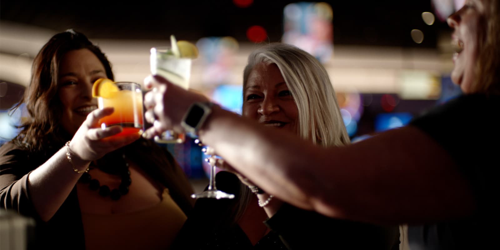 Friends celebrating together with drinks